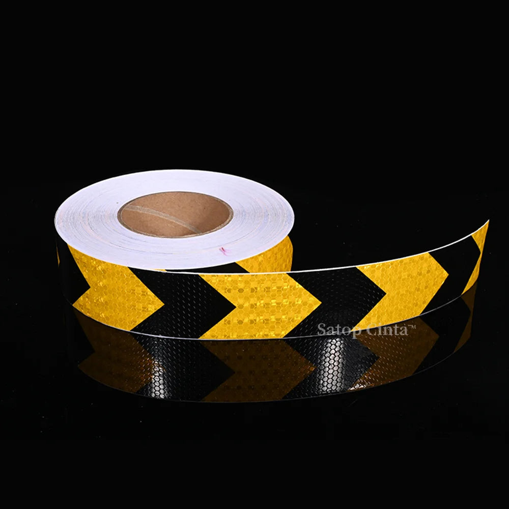 Roll of yellow and black high-visibility reflective safety tape for vehicles