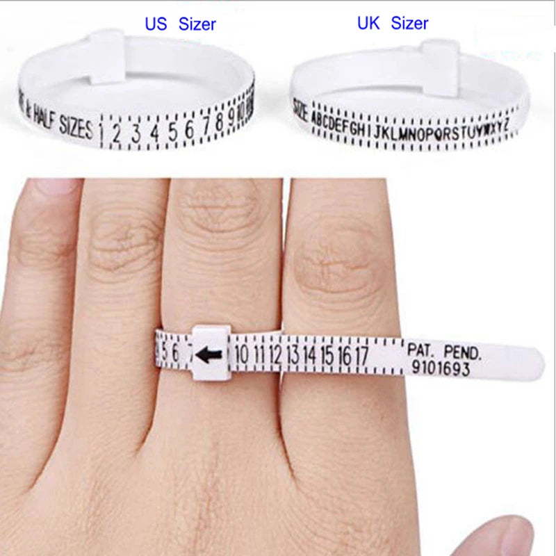 A hand wearing a white adjustable ring sizer measuring tool on a finger.