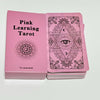 A pink box containing a 78-card deck of Pink Learning Tarot cards featuring intricate designs and an eye symbol.