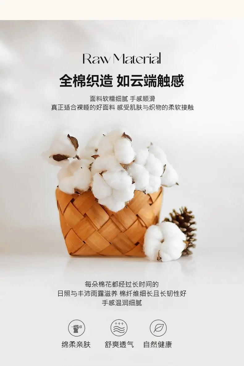 A woven basket filled with fluffy white cotton products, including bedding items like a duvet cover, fitted sheet, and pillow