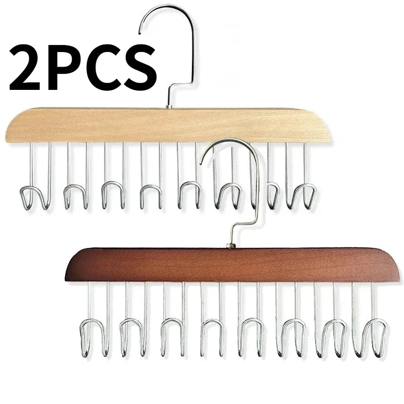 Two wooden hanging clothes racks with multiple metal hooks for clothing organization