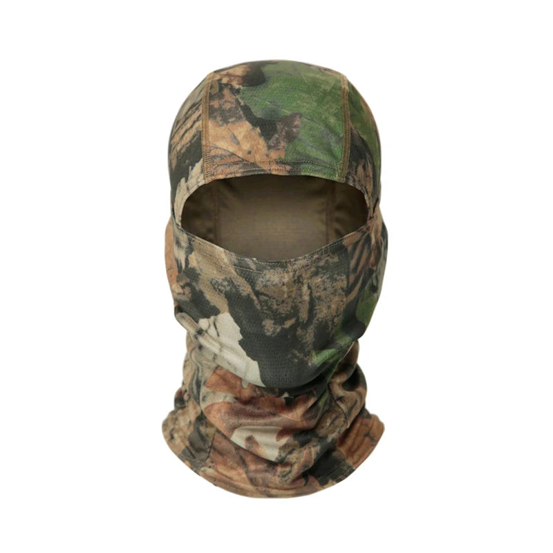 A camouflage balaclava cap worn on a mannequin, featuring brown and green leafy patterns.