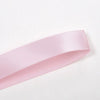 A roll of pink double face satin ribbon.