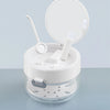 A clear portable denture case with a lid open, showing a cleaning brush and storage components.