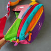 A colorful color block waterproof nylon fanny pack with various bright stripes and orange accents.