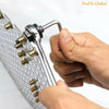A hand is holding a silver manual rivet nut tool with an interchangeable head, showing the tool's design.