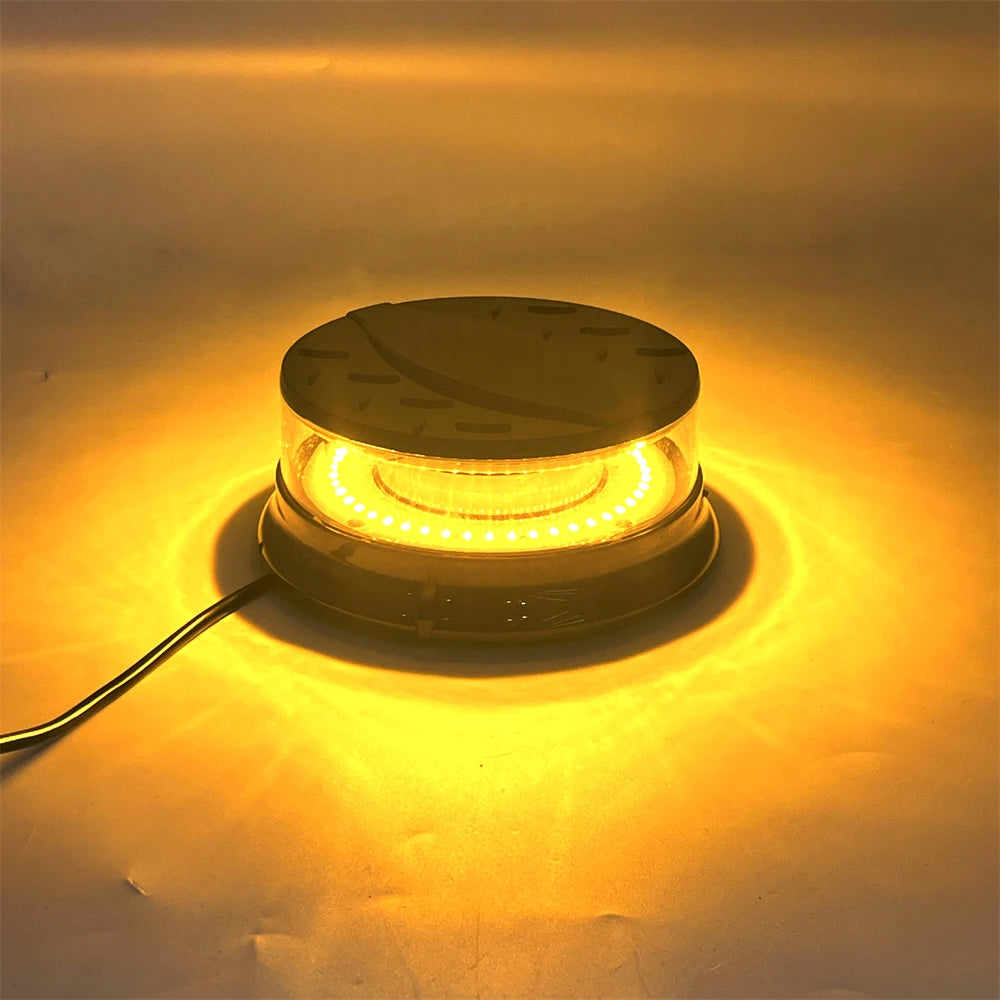 An LED emergency strobe light mounted on a magnetic base, emitting a bright yellow glow.