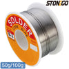 A spool of solder core wire, model B-2, with an orange and white label, ready for soldering work.