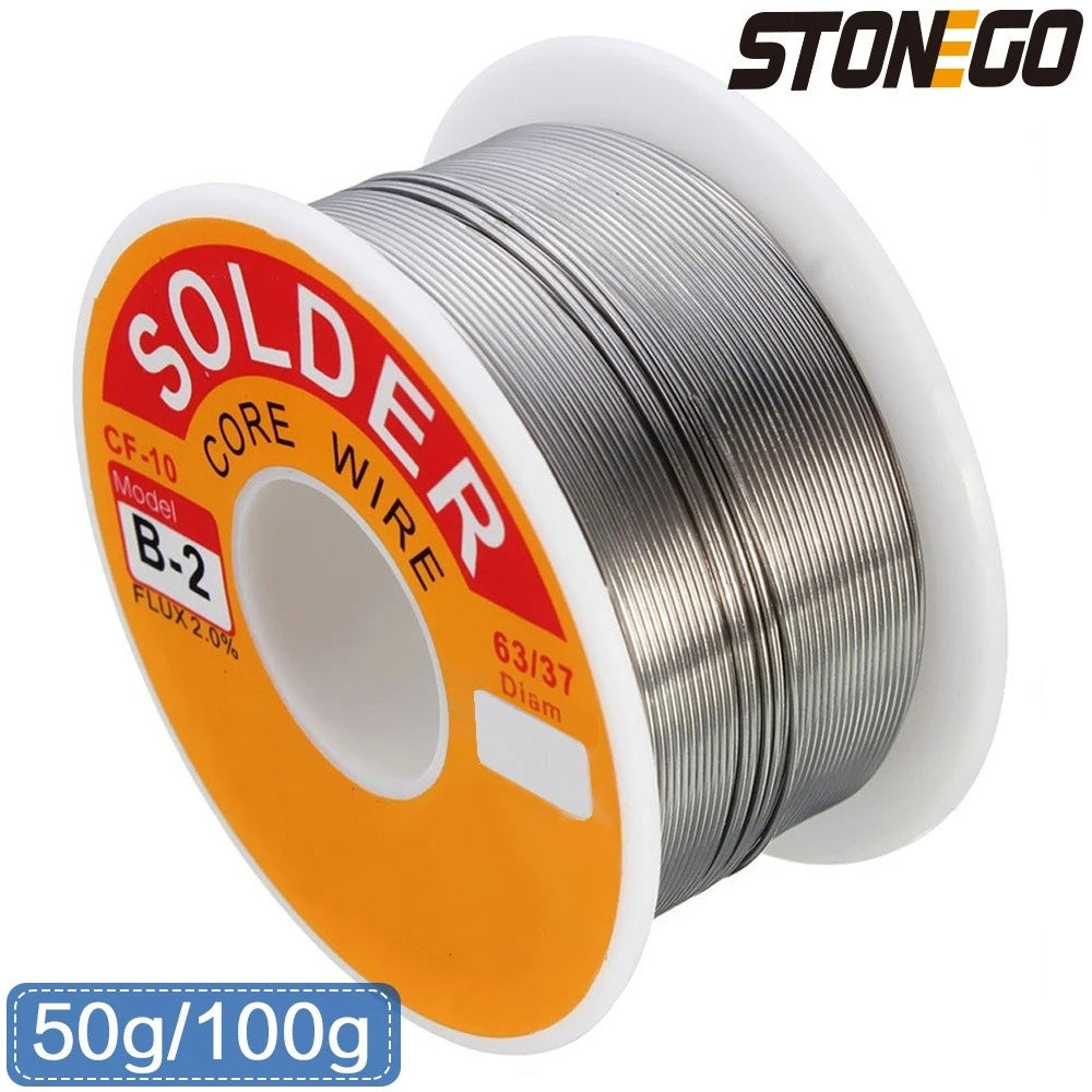 A spool of solder core wire, model B-2, with an orange and white label, ready for soldering work.