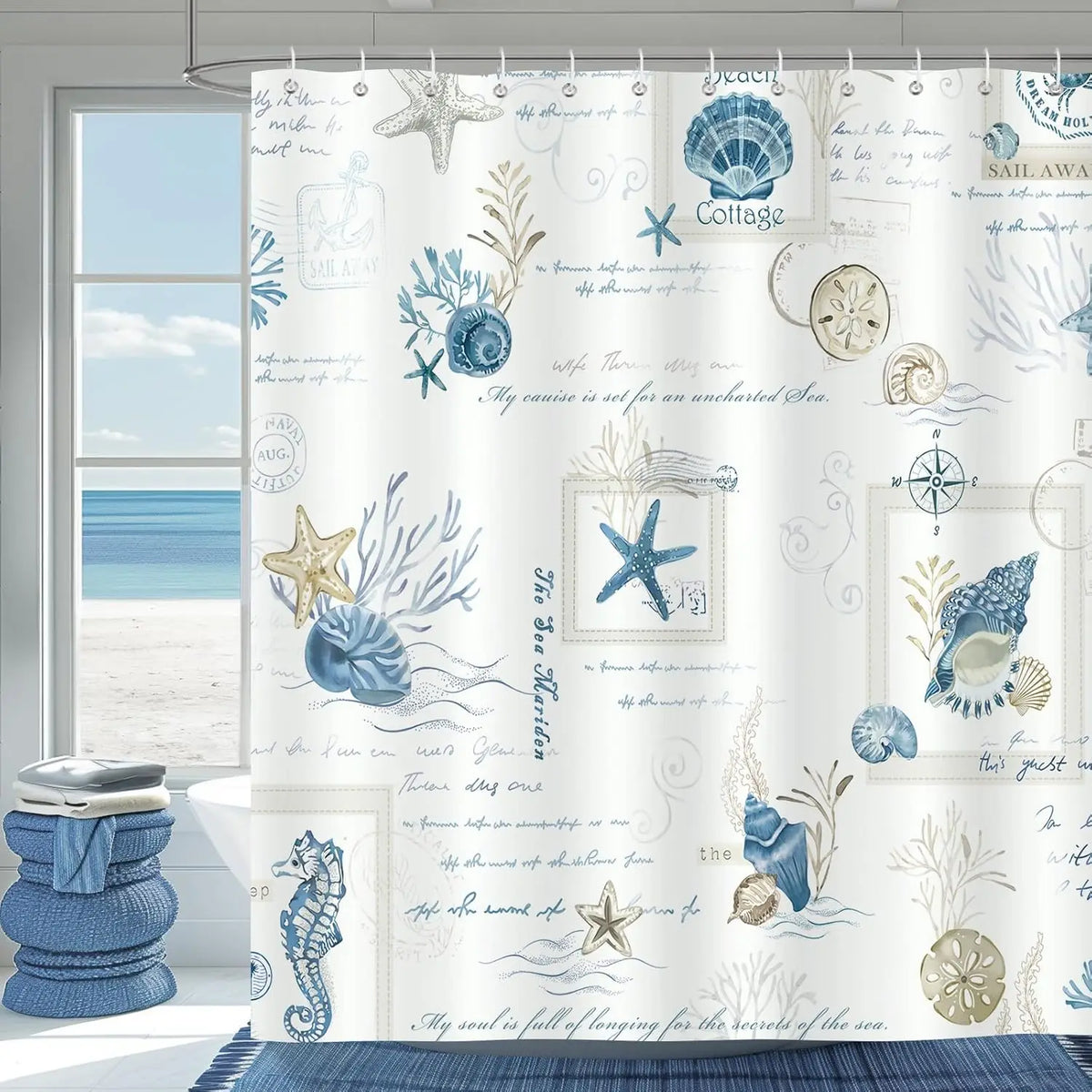 A white shower curtain featuring blue nautical starfish, shells, and sea motifs.