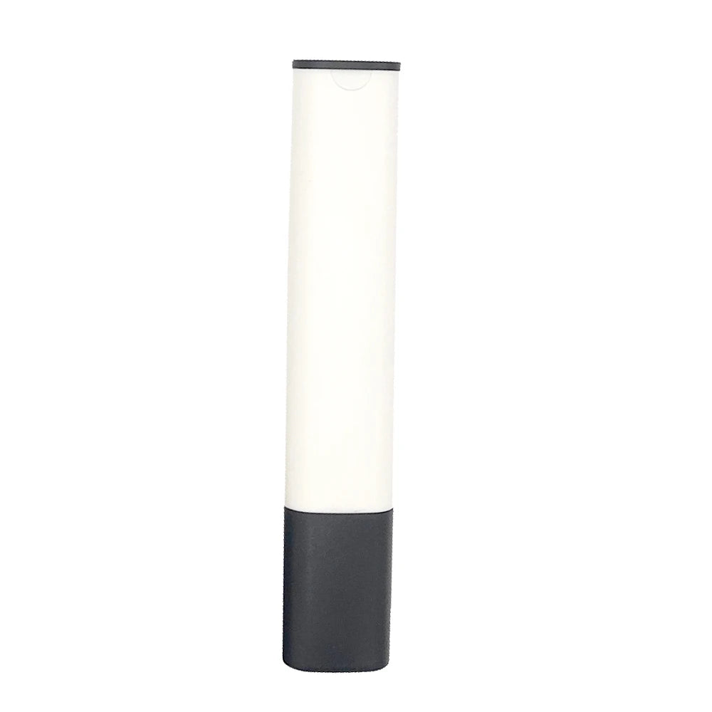 A tall, cylindrical digital water quality tester with a white upper section and a dark gray base.