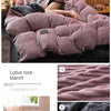 A set of reversible corduroy duvet covers featuring a velvet-sided finish in dusty rose and charcoal colors.