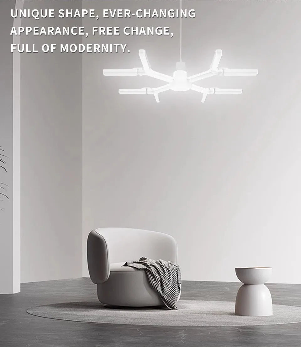 Modern white pendant light fixture illuminating a minimalist interior space.