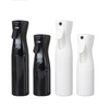 A set of four black and white continuous fine mist spray bottles for hair, plants, and home use