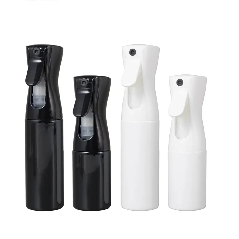 A set of four black and white continuous fine mist spray bottles for hair, plants, and home use