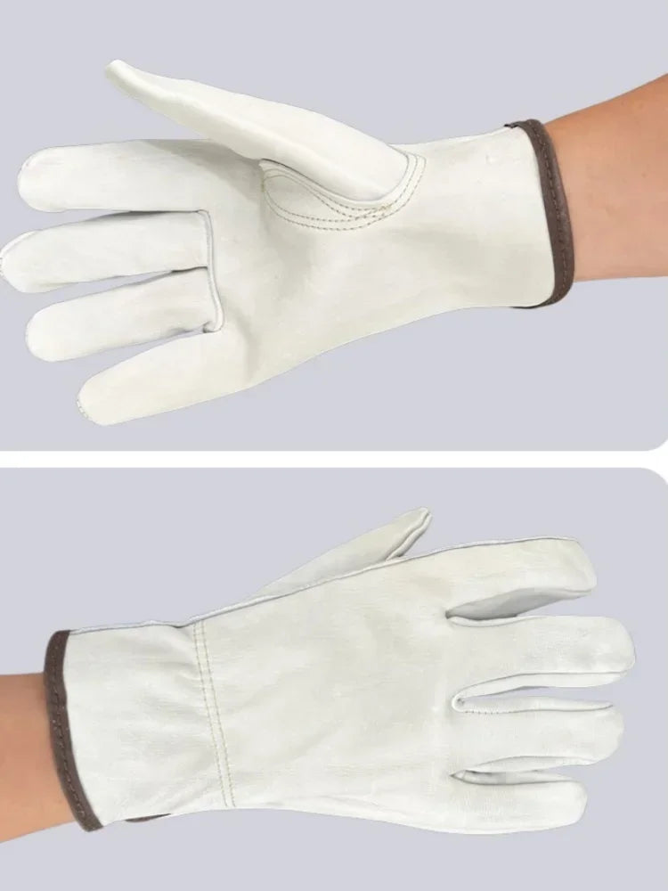 A pair of light beige heavy-duty cowhide leather work gloves shown on a hand.