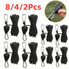 Set of eight heavy-duty camping rope tighteners with ratchet locks in black and silver.