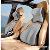 A beige car seat features a gray memory foam headrest and lumbar support cushion for back comfort.
