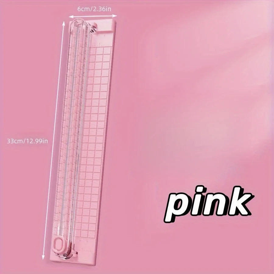 A pink portable paper cutter trimmer with a 6cm blade and 33cm length.