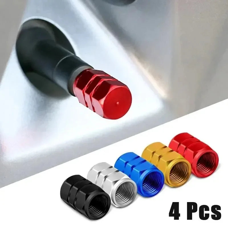 Set of four red and black aluminum alloy wheel tire valve caps with hexagon design