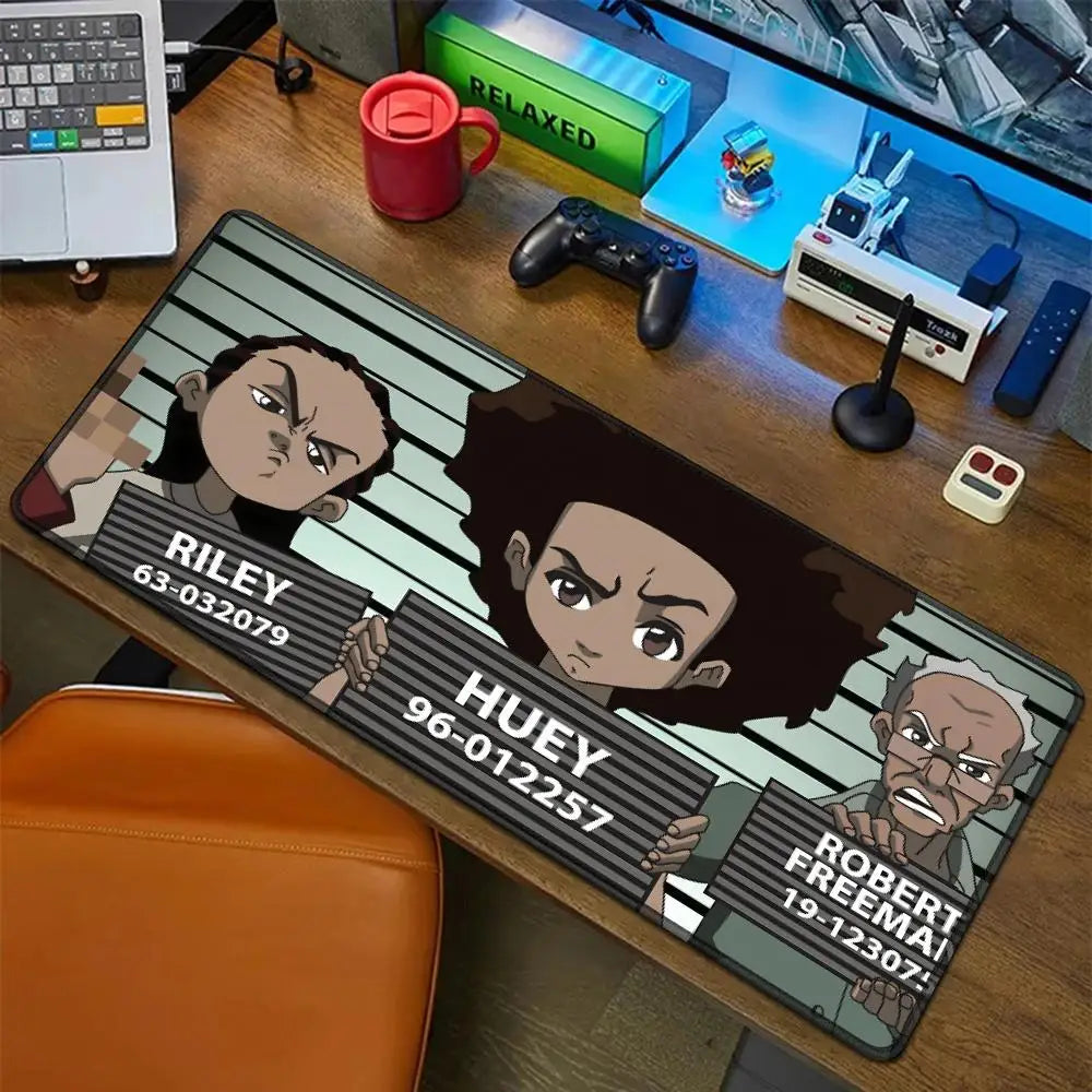 An oversized gaming mouse pad featuring cartoon characters Riley, Huey, and Robert Freeman on a wooden desk.