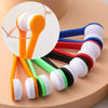 A set of portable microfiber glasses cleaning cloths and brushes in various colors, including orange, white, and green.