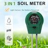 A green 3-in-1 soil meter with a light sensor, pH, and light indicator displayed outdoors in green grass.