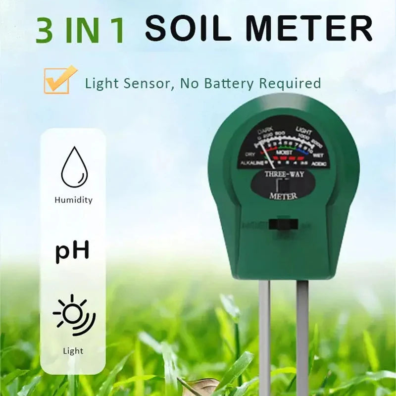 A green 3-in-1 soil meter with a light sensor, pH, and light indicator displayed outdoors in green grass.