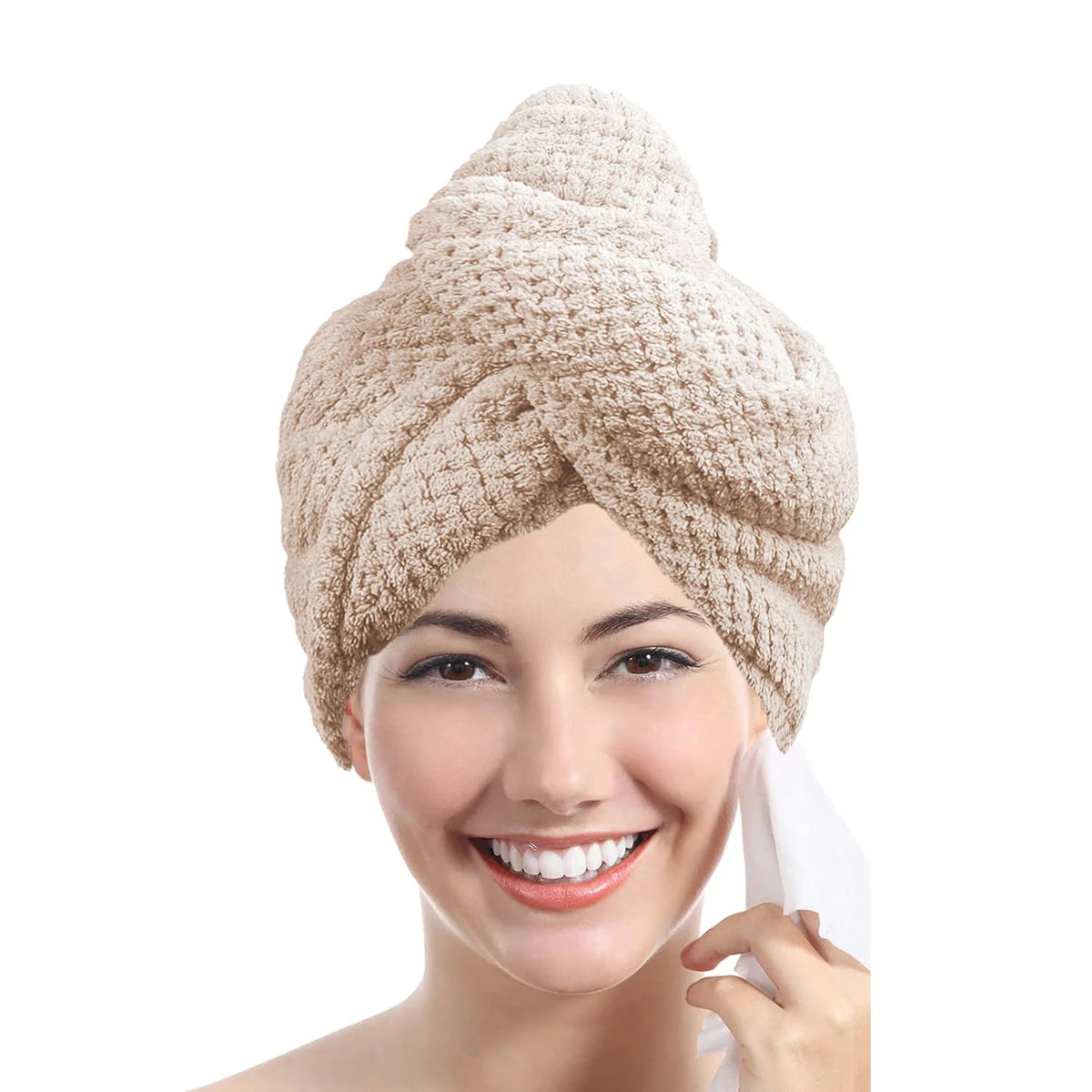 A woman is smiling while wearing a beige microfiber hair towel wrap on her head.