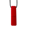 A bright red silicone sensory chew necklace pendant with a textured surface, hanging from a black cord.