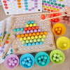 A wooden bead maze puzzle with colorful beads arranged in a grid and various colored plastic muffin tins.