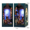 A wooden book nook kit featuring an ornate interior with LED lighting and detailed scenery.