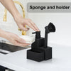 A hand is using a black sponge and holder device to dispense soap from a kitchen faucet.