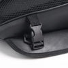 Black motorcycle tail bag with a black strap closure shown in a close-up view.
