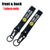 Black front and back single piece keychain with Save The Manuals text