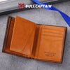 A brown genuine leather men's bifold wallet with stitching shown open on a gray surface.