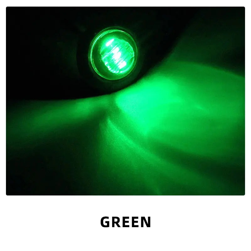 A bright green LED side marker light shining a beam in a dark environment.