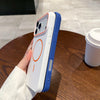 A hand holds a white and blue Magnetic Matte phone case with MagSafe support on a wooden table.