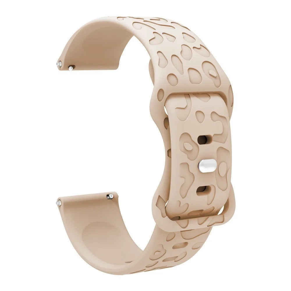 A beige silicone watch band with a textured pattern is shown in a curved shape.