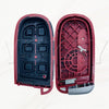 A pair of replacement smart key shells for Dodge Challenger and Charger models, shown in red and black.
