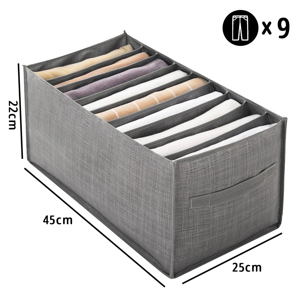 A gray fabric closet organizer box showing nine folded garments with handles.