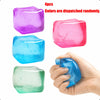 Four colorful squishy stress cubes are shown, with one cube being held in a hand.