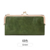 A dark olive green vintage kiss lock long wallet with gold hardware.
