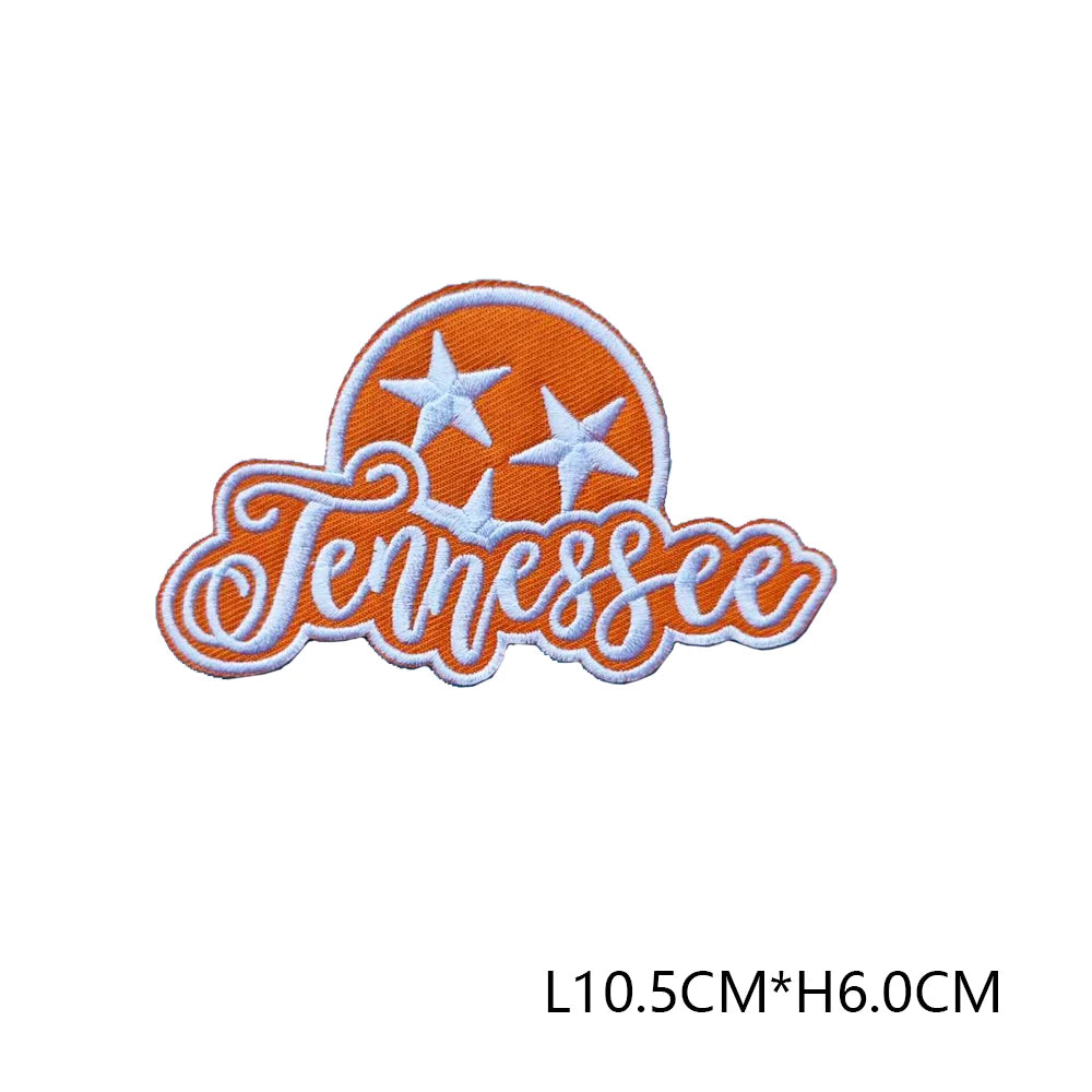 Orange embroidered letter patch spelling Tennessee with white stars