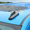Blue car antenna cover trim installed on a vehicle roof, featuring an IDX logo.
