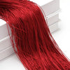 A close-up of a long, vibrant red beaded thread curtain hanging down.