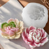 Pink and white heart flower silicone mold for crafting projects resting on a light surface.