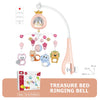A pink treasure bed ringing bell mobile featuring a crown, various hanging toys, and a light fixture.