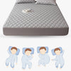 A gray quilted waterproof pillow protector with a soft, breathable fabric and envelope closure.
