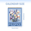 A blue desk calendar for 2026 featuring a floral design and monthly planner layout.
